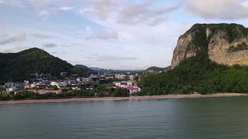 An aerial view cave Beach with traditional long tail boat on Ao Phra Nang Beach, climbing rock desti