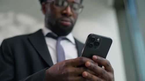 Upset African American Male Guy Businessman Business Man in Office Looking Smartphone Reading Bad