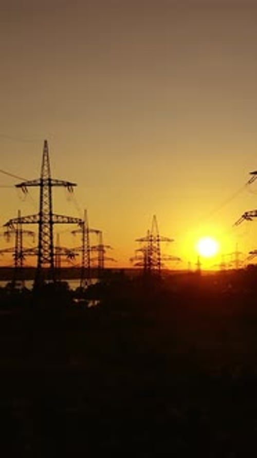 Electricity transmission lines. Distribution electric substation with power lines. Vertical video