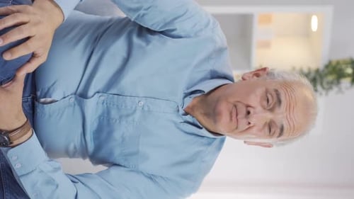 Vertical video of Suspicious old man thinks.