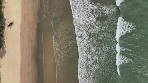 Waves And Empty Sandy Beach