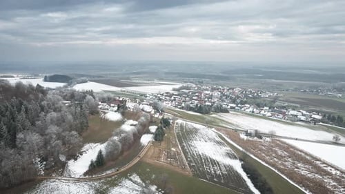 Quiet Winter Morning Overlooking A Small Snow Covered European Village