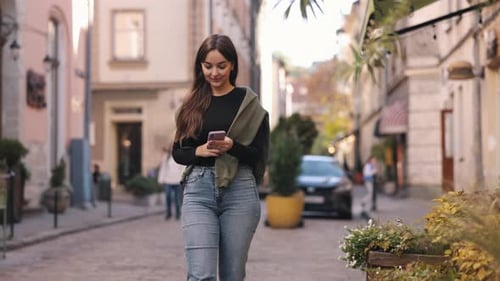 Stylish Woman Strolling Through Charming European City