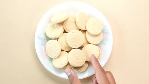 Top View of Hand Pick Sweet Cookies on Table