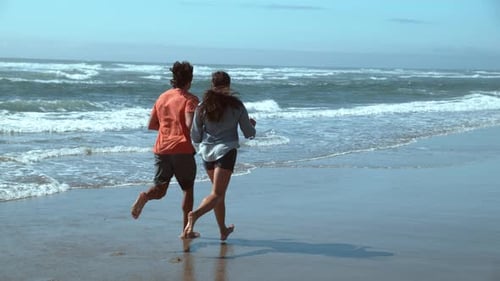 Couple At Beach Running In Super Slow Motion