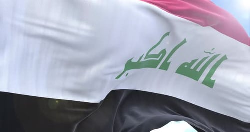 Realistic Iraq Flag Waving Loop Against Blue Sky