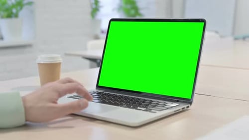 Man Using Laptop with Chroma Key Green Screen