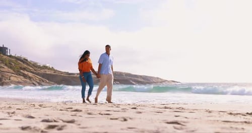 Couple, beach and holding hands on walk together for love, happiness and holiday in summer sunshine