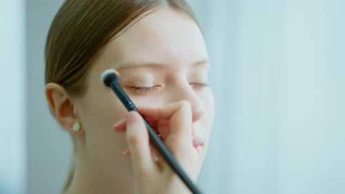 Makeup Artist Work in Her Beauty Studio Portrait of Woman Applying By Professional Make Up Master