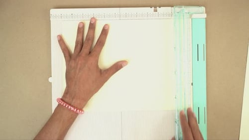 Cutting Paper on a Scoring Board