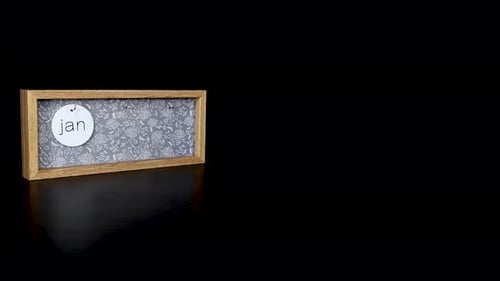 A wooden calendar block showing the date January 24th
