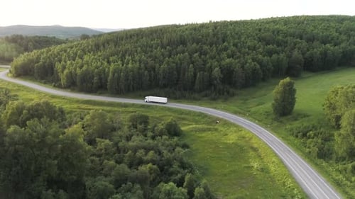 Panorama with Truck Driving on Highway in Summer