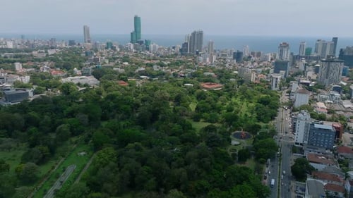 Aerial Panoramic View of Urban Borough Green Vegetation in Park and Town Development with Sea in