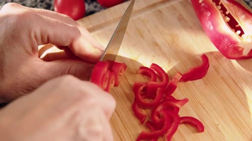 Top Down View Female Hands Cut Red Fresh Pepper on Board Closeup