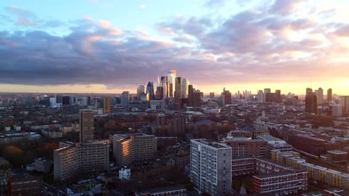 City of London skyline and skyscrapers sunset. Cinematic aerial view