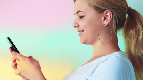 Smiling Woman Using Smartphone Close Up