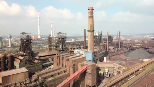View from above. Industrial landscape of the old metallurgical plant. Blast furnace tower, with ore