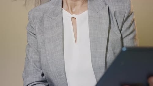 Cinematic video of a beautiful senior business woman in studio