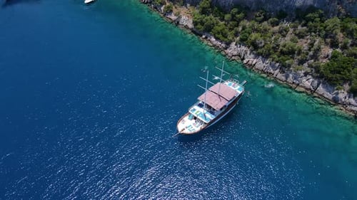 Beautiful view of the beach with boats, pure nature, sea and ships. Shot from a drone.
