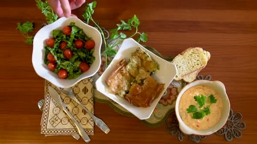 Healthy mediterranean cuisine, three dishes concept for lunch or dinner. Closeup of getting the letu