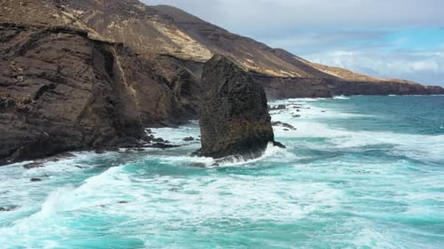 Aerial view of Cofete Beach with Roque del Moro on a cloudy day, Fuerteventura