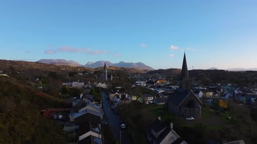 Aerial drone footage of St Joseph’s Church and Christ Church Clifden with Connemara Mountains