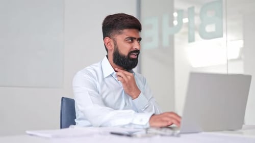 Unwell Indian Professional Working in Office