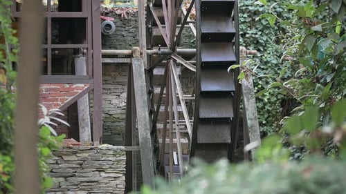 The Old Mill That Turns With Water In The Forest In The Village