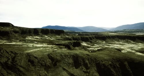 Landscape Features Rugged Terrain Under a Bright Sky in a Remote Area