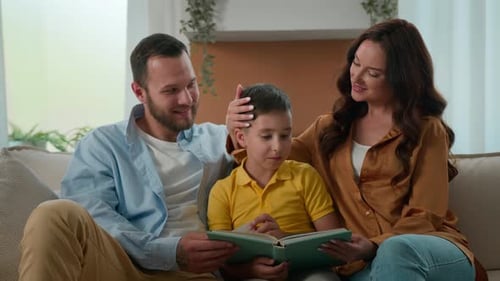 Loving Caring Mom Dad Reading Fairy Tale Story to Cute Son Parents Kid Boy Child Relaxing Together