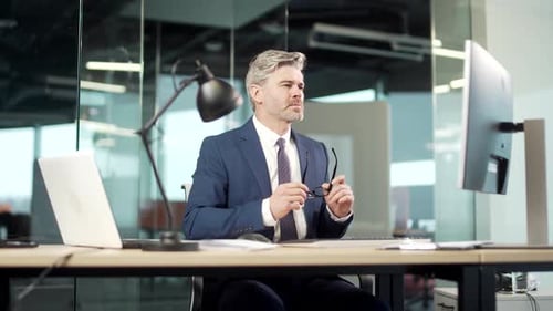 Mature businessman Employee in suit job done Satisfied office worker leaning back business man relax