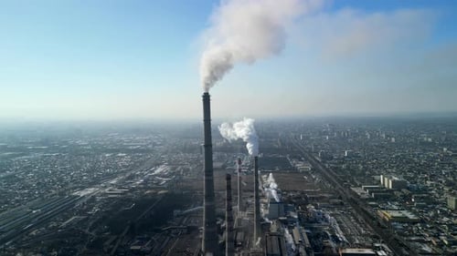 Bishkek thermal power station, closer look at the chimneys with smoke