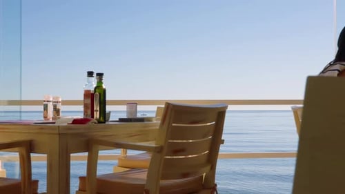 Several clips of an empty table at a beach restaurant