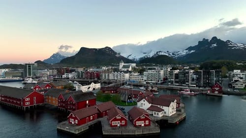 Aerial Approach to Lamholmen at Midnight Sun with Storoya Church and Svolvaer City