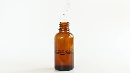 Cosmetic Bottle with Pipette on White Background Cosmetic Spa Medical Skin Care Advertising of a