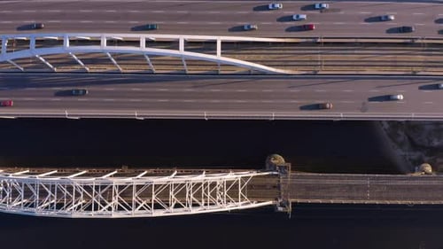 Birds Eye View From Drone of Bridge Road Over River with Moving Cars