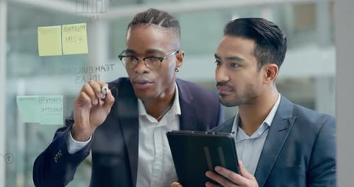 Business men, partnership and writing on glass, tablet and team building together with notes