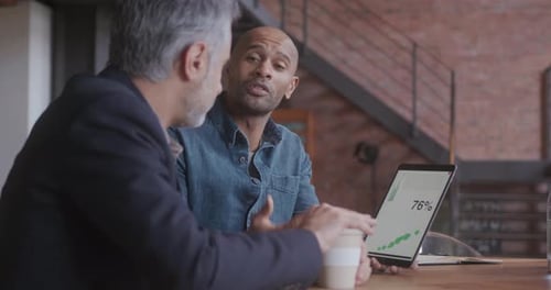 Two Business Men Meeting in Creative Office with Technology
