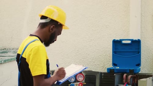 Technician Inspecting Freon Levels
