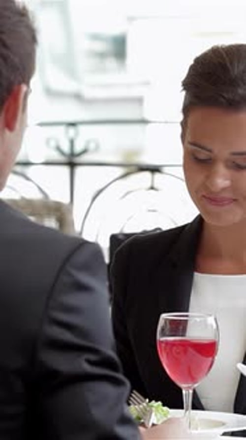 Charming Couple Enjoying a Business Lunch on a Terrace
