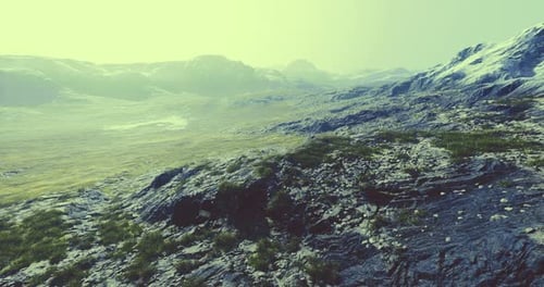 Vast Landscape Shows Rocky Terrain and Distant Mountains in Bright Sunlight