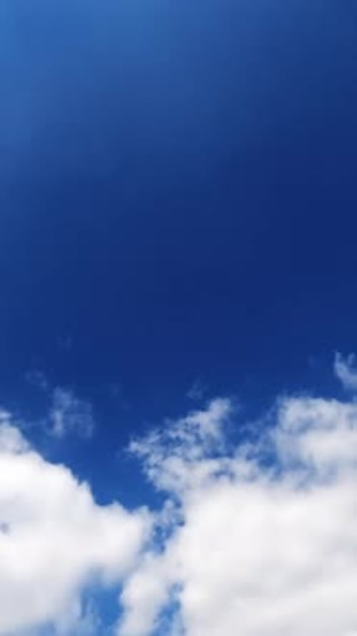 Light white clouds floating quickly in the bright blue skies.