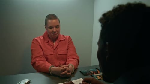 Woman Handcuffed During Interrogation in Office