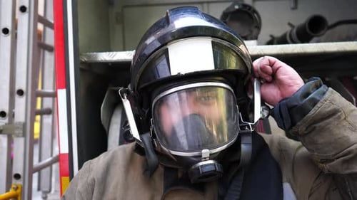 Firefighter Removes Helmet after the Emergency