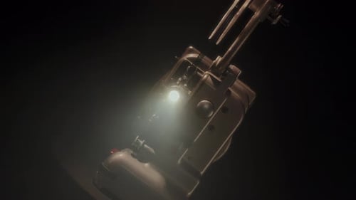 Vintage Film Projector Emitting Light