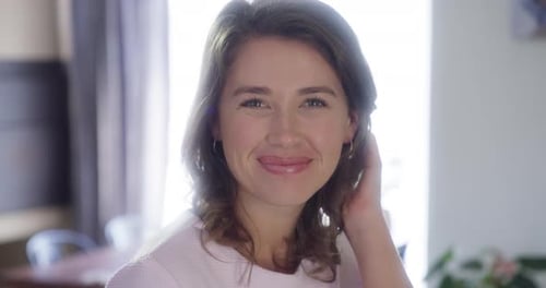 Smiling Woman with Brown Hair in Natural Light