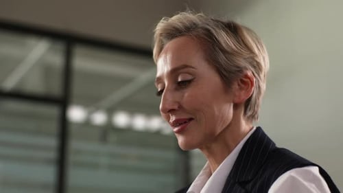 Closeup Face of Tired Middleaged Businesswoman Using Mobile Phone on Evening on Office Feeling