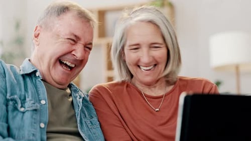 Senior Couple Laughing Together at Home