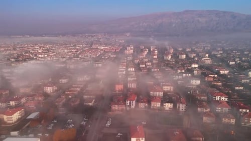 the view of the clouds over the city from the air