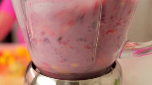 Berry And Mango Smoothie Mixing In A Kitchen Blender
